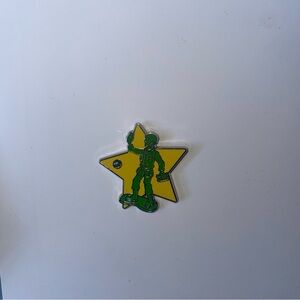 Disneyland 2023 hidden Mickey green arm man pin